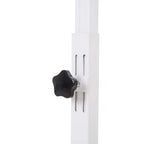 Height adjustment hand knob on white support column for over-bed table