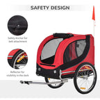 Red and black pet bike trailer with reflectors, safety anchor, and rear wheel
