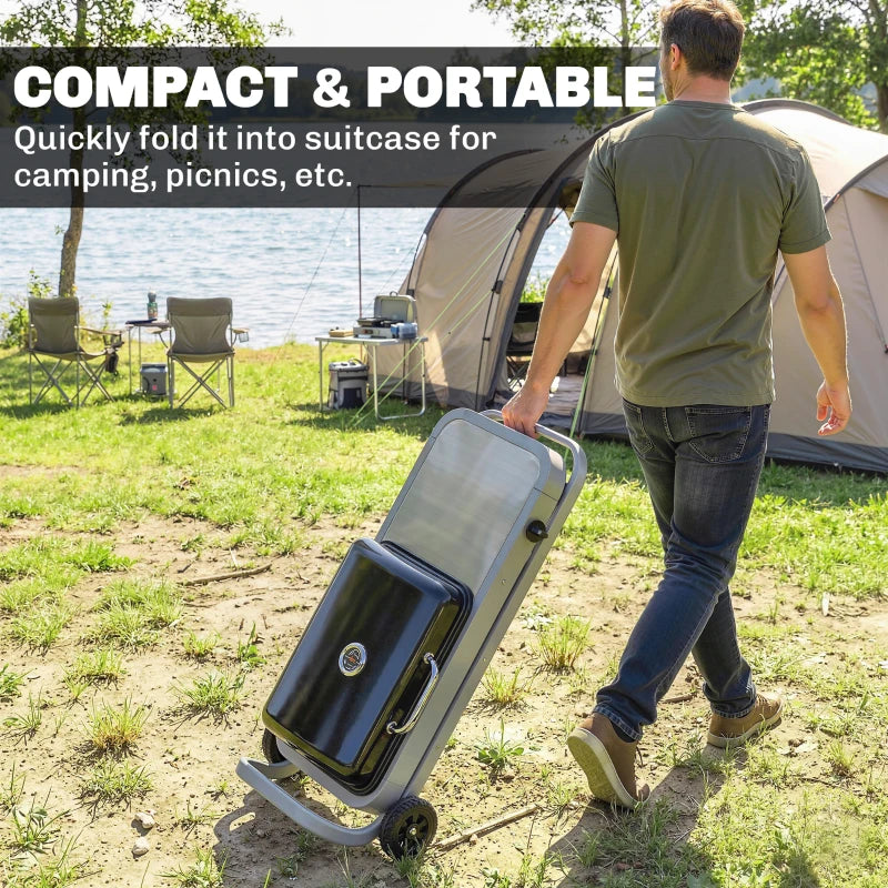 Compact portable gas BBQ grill folded upright, black lid and handle
