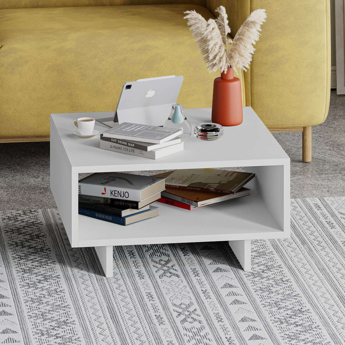 White modern coffee table with wide top and open storage shelf