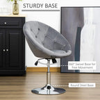 Grey swivel dressing stool with round steel base and button tufted padded seat