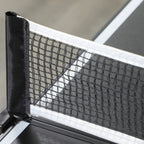 Close-up of net on aluminum posts for a black folding ping pong table