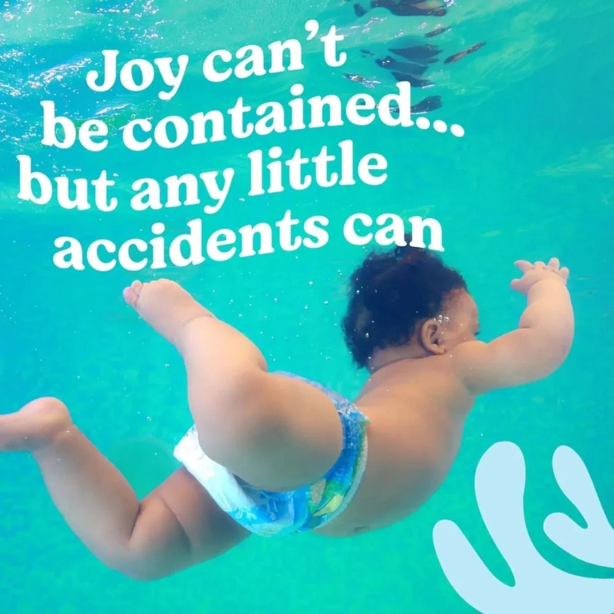 Blue disposable swim diaper on child in pool, arms out