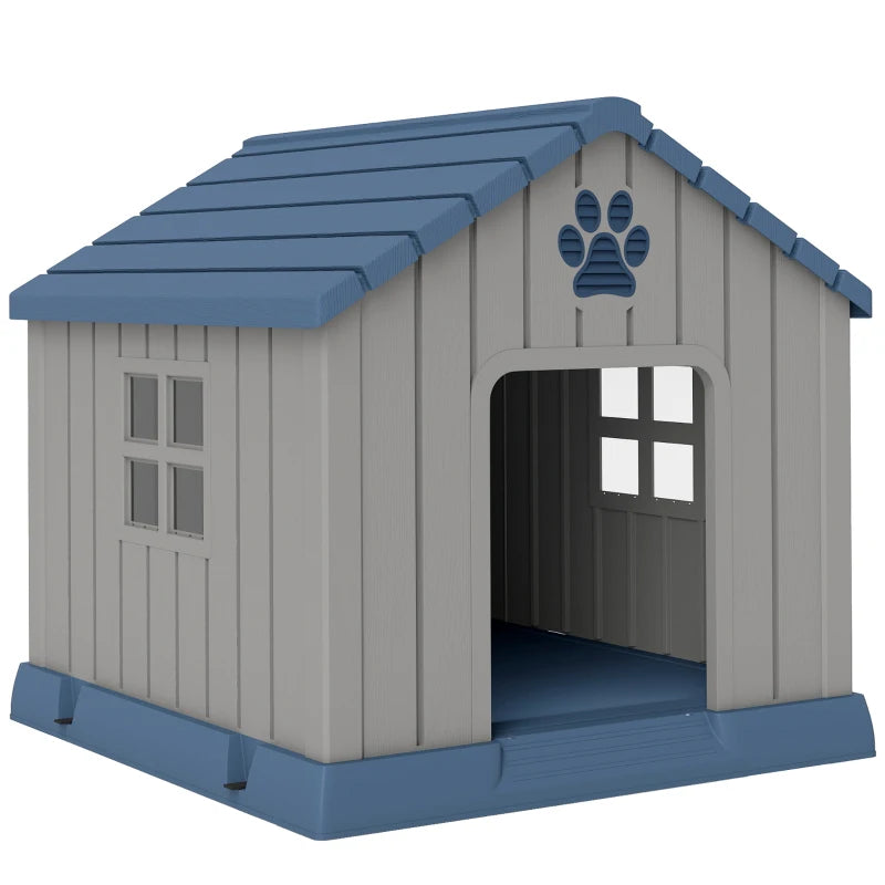 Grey plastic dog kennel with blue slanted roof, front door opening, paw print detail