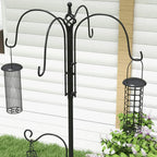 Black bird feeding station pole with two hanging mesh feeders and curved arms