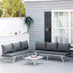 Grey outdoor corner sofa set with padded back cushions and coordinating slatted metal coffee table
