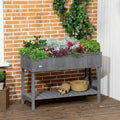 Dark grey rectangular plant stand on legs with herbs and flowers, lower shelf visible