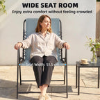 Light grey folding garden chair with wide seat, high back, and armrests; person seated