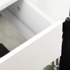 White drawer interior with a perforated tray surface for shoes