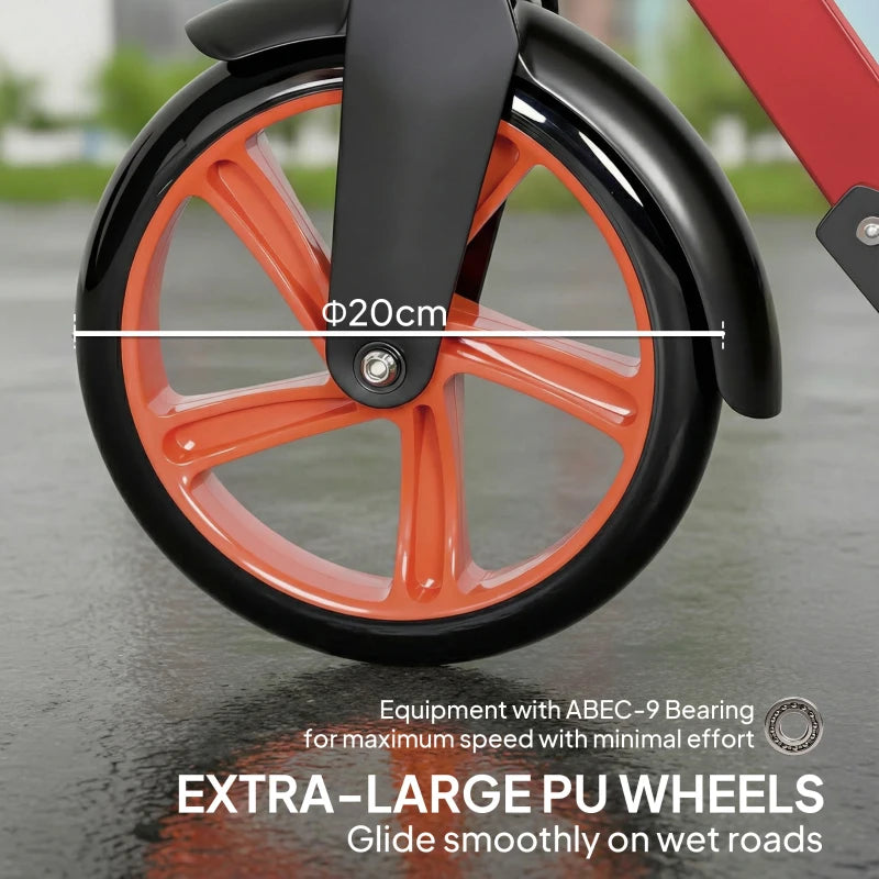 Close-up of orange spoked wheels and black front fender on red and black scooter