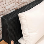 Black woven armrest corner with beige cushion close-up, showing stitched cushion edge