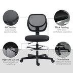 Black armless standing desk chair with mesh back and padded seat, chrome footrest, swivel base