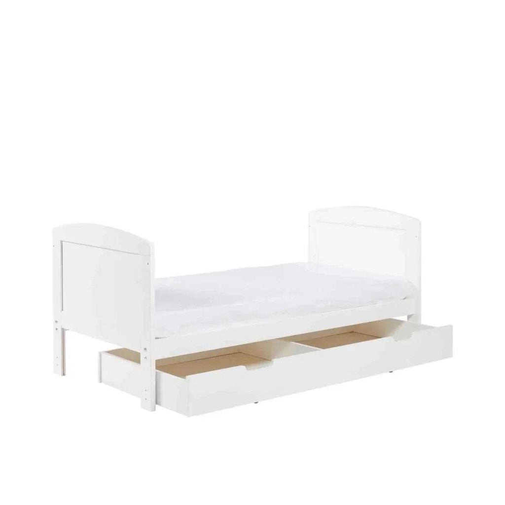 White cot bed with open under-drawer storage and slatted front