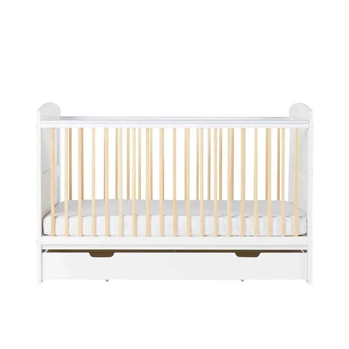 Front view of white cot bed with light wood slats and under-drawer