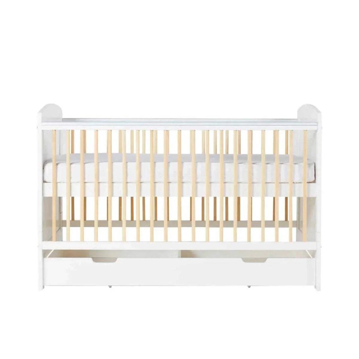 White cot bed front view with light wood slats and under-drawer storage