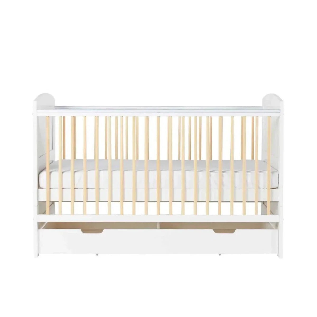 White cot bed front view with light wood slats and under-drawer storage