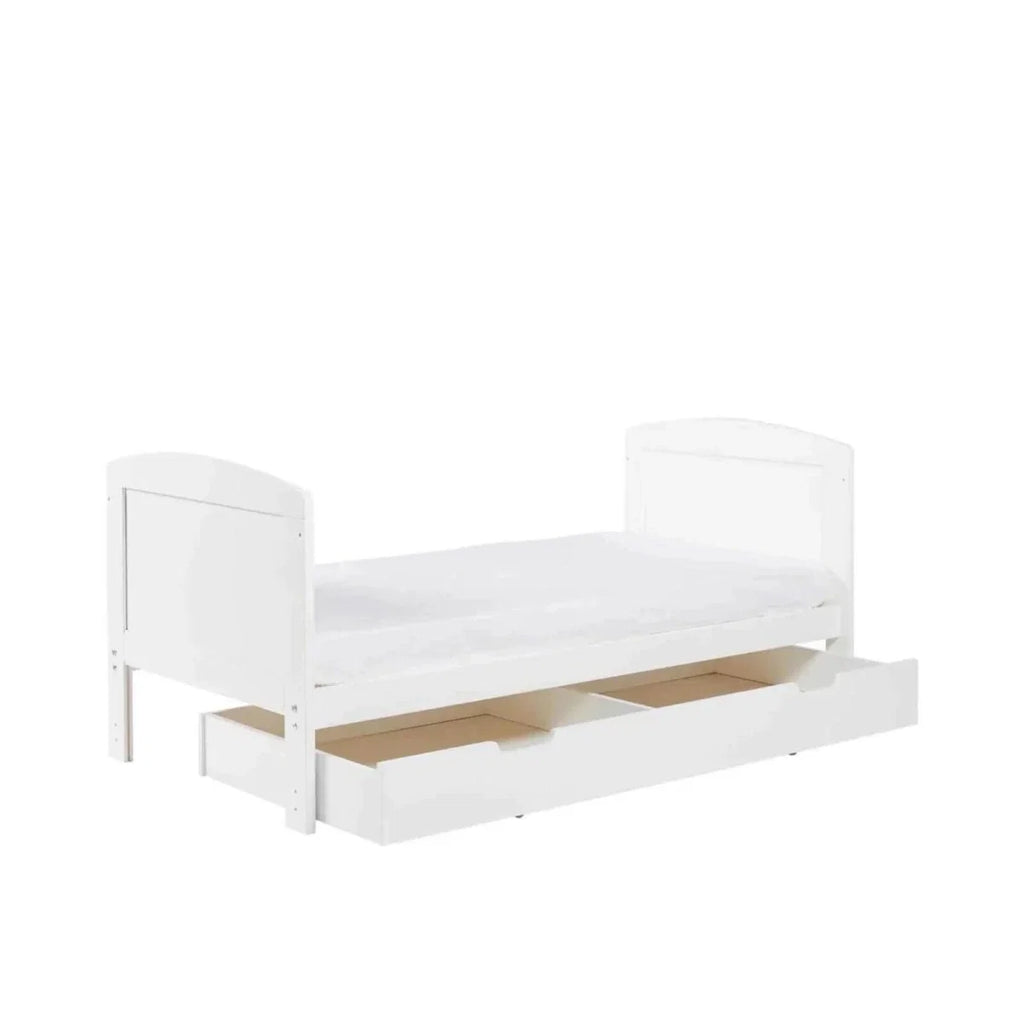 White cot bed with under-drawer storage, open front view and raised side panels