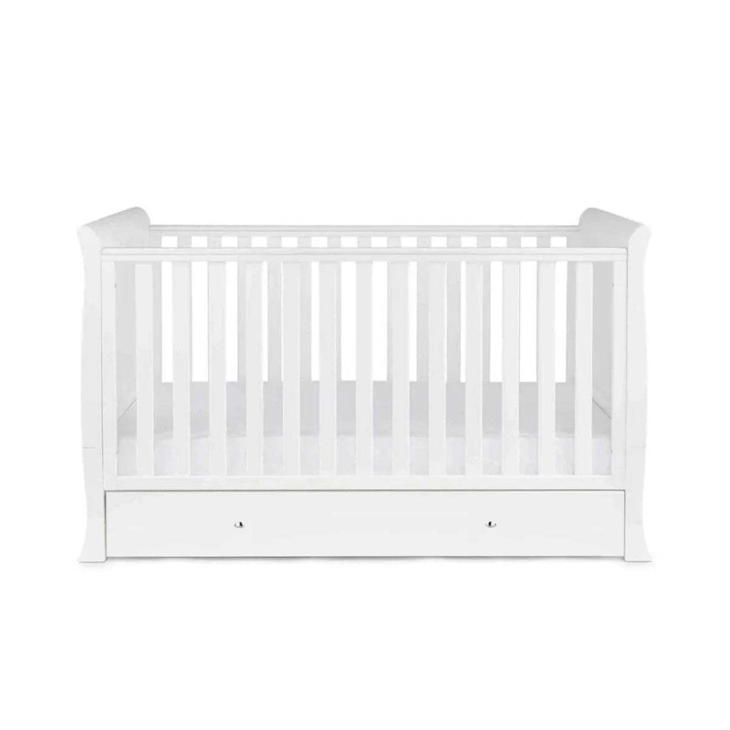White cot bed front view with vertical slats and drawer storage
