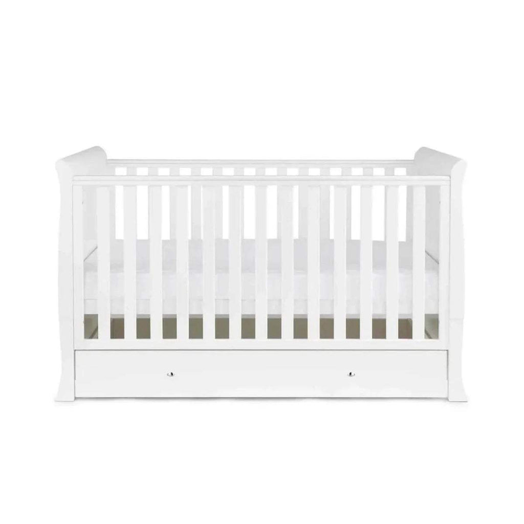 White cot bed with mattress base and front drawer panel