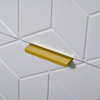 Gold bar drawer pull on embossed white and grey cabinet panel