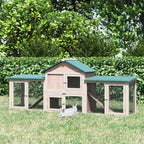 Outdoor wooden guinea pig hutch with green roof panels, wire mesh sides, and ramp access