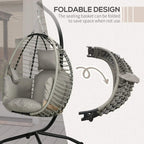 Foldable grey hanging egg chair with woven shell and padded seat and back cushions