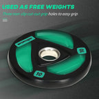 Black Olympic weight plate with green accents, tri-grip cutouts, 5 cm center hole