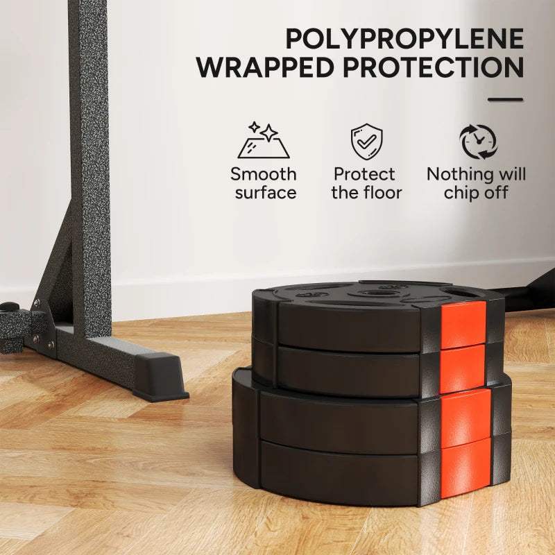 Stacked black weight plates with orange protective edge blocks on a floor