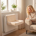 Cream plush cat radiator bed on a radiator with padded seat and backrest