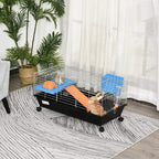 Small two-tier guinea pig hutch in black with blue and orange accessories on floor
