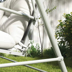White patio chair cushion set with tie straps at corners on a metal swing frame