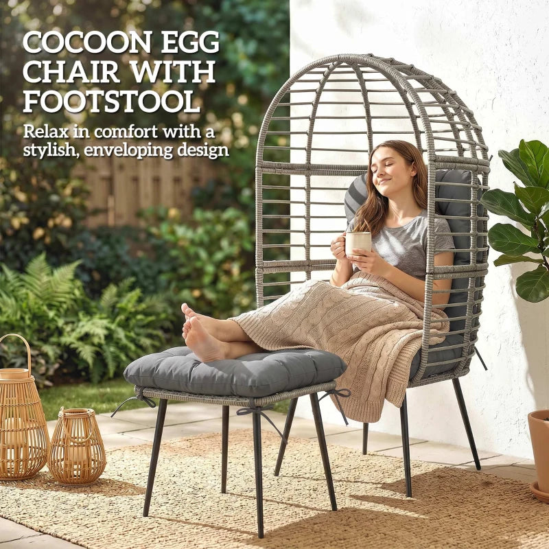 Rattan egg chair with enclosed curved back and matching cushioned footstool