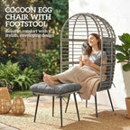 Rattan egg chair with enclosed curved back and matching cushioned footstool