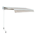 Retractable manual/electric awning with cream-white fabric, scalloped valance and pull handle