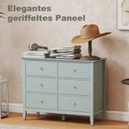 Green fluted chest dresser with six drawers, gold knobs, and tapered legs