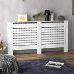 White radiator cover cabinet with twin grille doors and horizontal slats across the front.