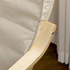 Detail of cream cushion corner on a light wood lounge chair armrest