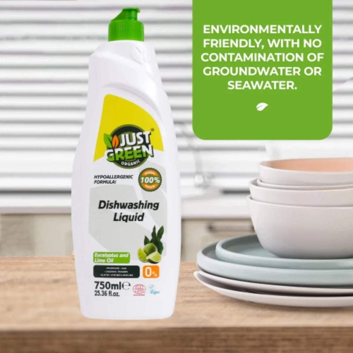 Just Green organic dishwashing liquid bottle with green pump beside stacked white bowls