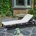 Outdoor adjustable rattan sun lounger with cream cushions and headrest, dark woven frame