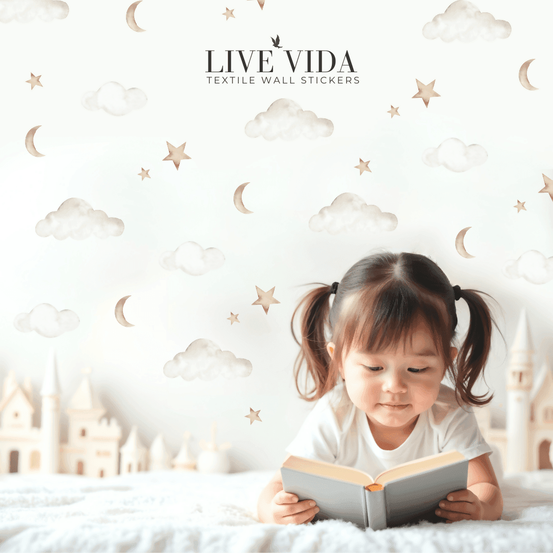 Cloud, moon & star wall stickers backdrop behind child reading