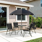 Outdoor black dining set with round glass table, open umbrella and four folding chairs