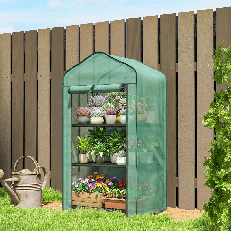 Green mesh mini greenhouse with three wire shelves and clear arched end panels