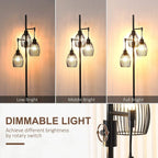 Black 3-light industrial floor lamp with three wire cage shades, softly lit