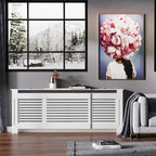 White radiator cover cabinet with horizontal vents and side panels, shown in a living room