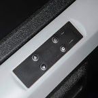 Close-up of cooler side buttons and power controls on black and white trim