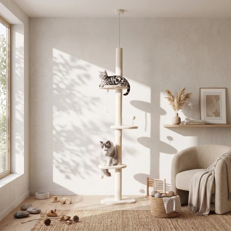 Beige cat tree with stacked perches and sisal scratching posts, cats lounging nearby