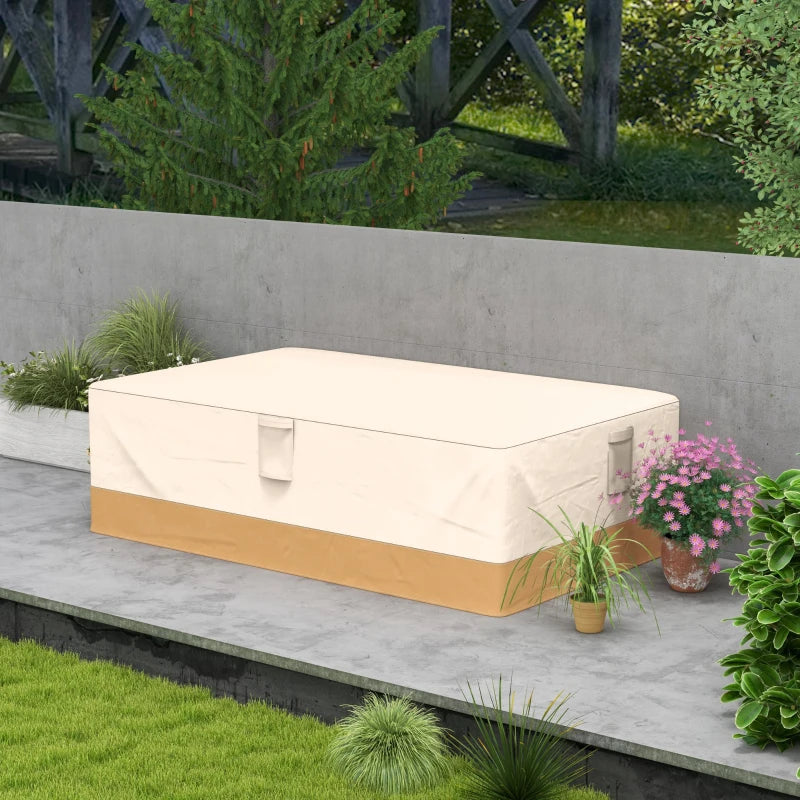 Beige rectangular garden furniture cover with corner tabs over outdoor seating.