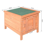Wooden guinea pig hutch with green padded top, hinged roof, and front door