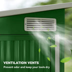 Green metal shed front with ventilation vents above lower paneling