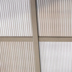 Close-up of grey gazebo curtain fabric with a corner support post